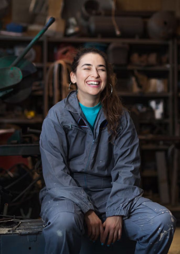 Girl in a workshop smiling